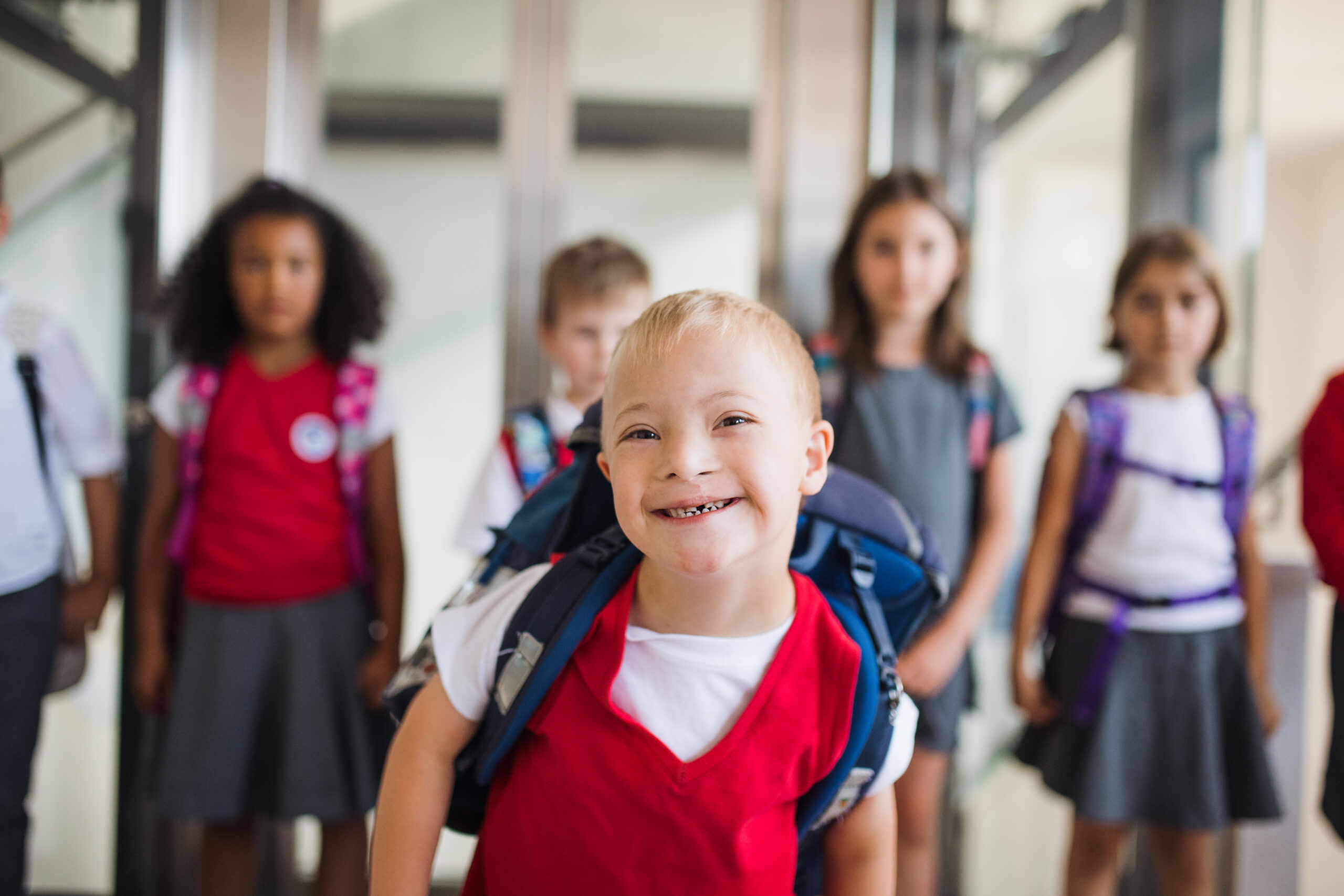 inclusive education young down syndrome child happy at school