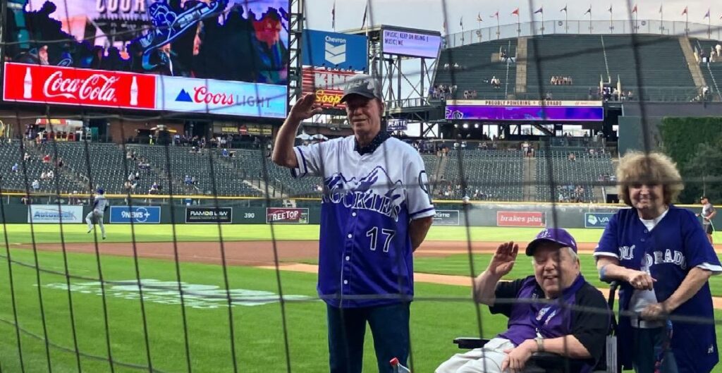 special needs adult who works for the CO Rockies on the field in Denver 