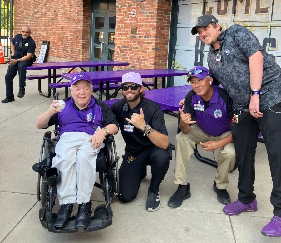 Steve front gate team taking a team pic at the Colorado Rockies stadium