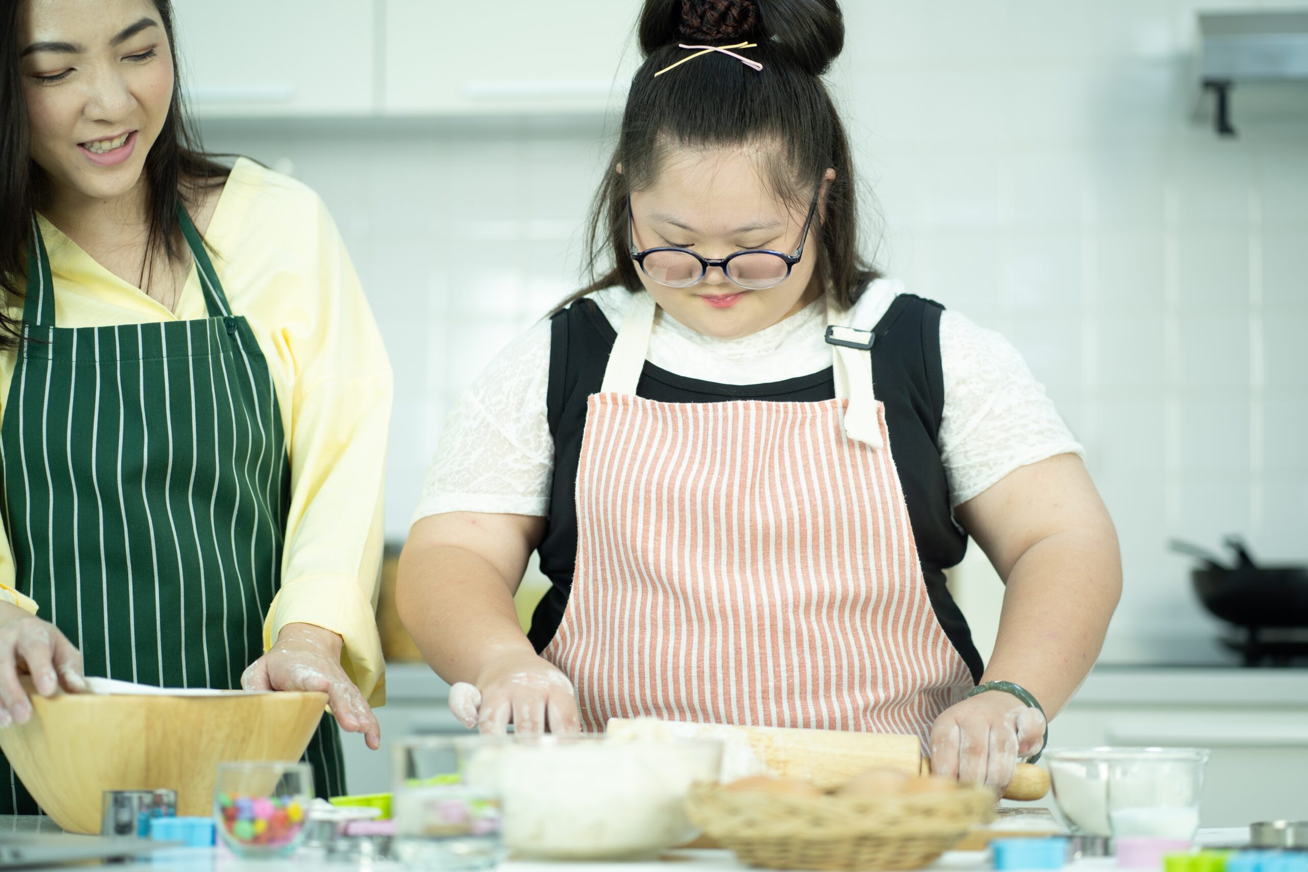 adult woman with IDD taking a cooking class