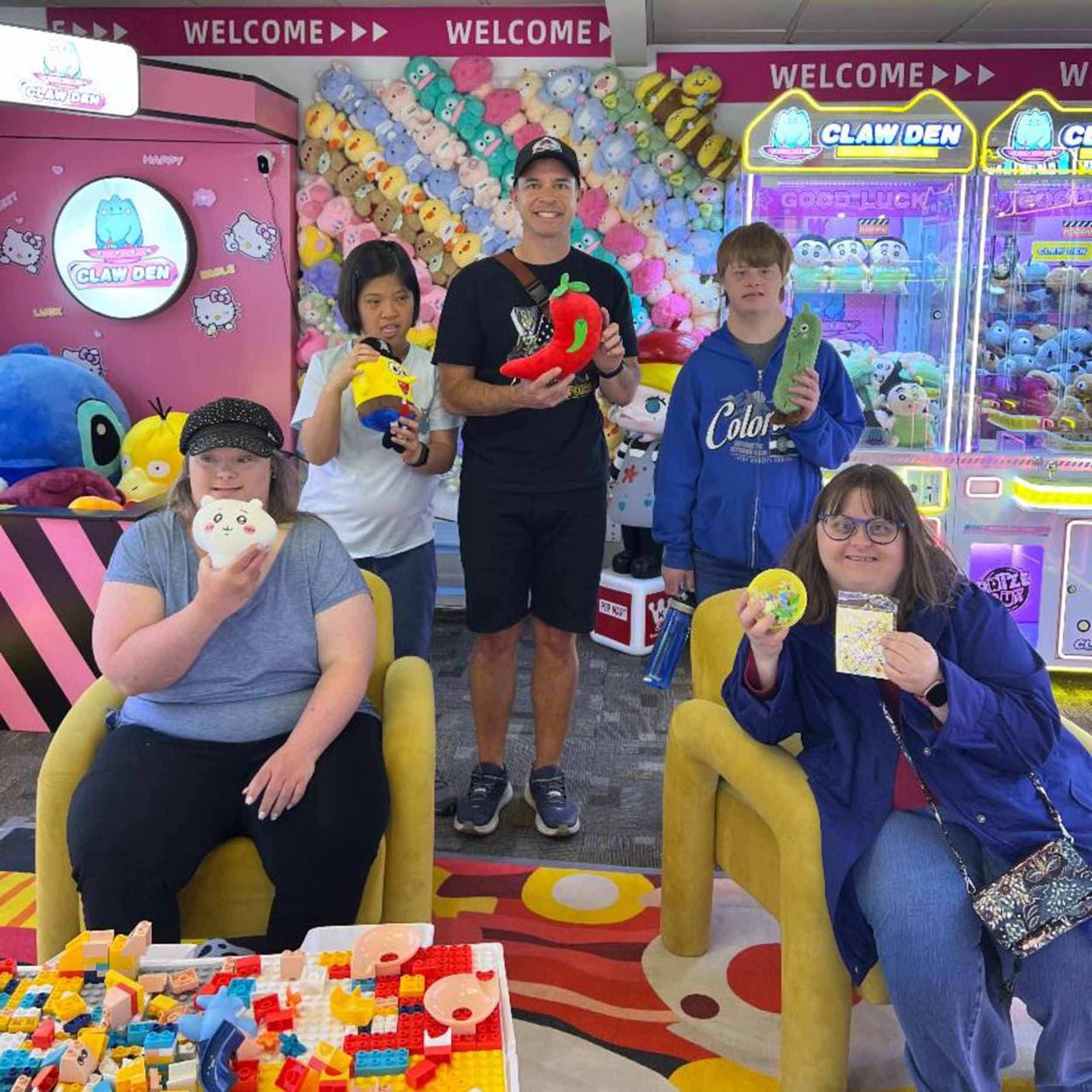 Participants of DDRC therapeutic recreation activity in an arcade