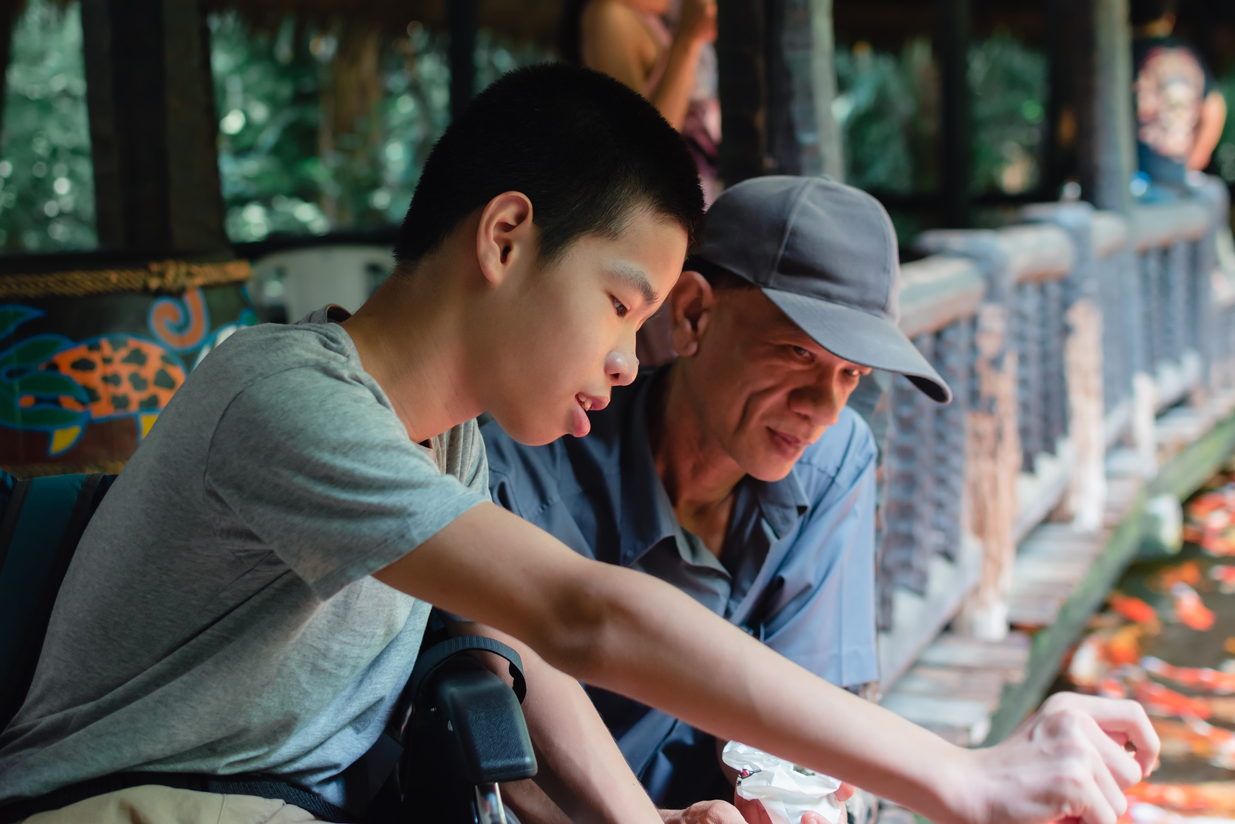 Father and his son with IDD at the zoo