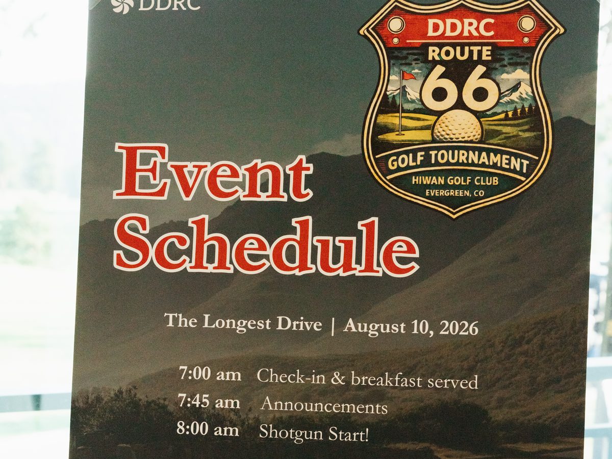 Event Schedule sign for the DDRC Route 66 Golf Tournament, The Longest Drive, August 10, 2026, at Hiwan Golf Club